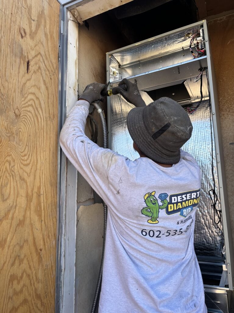 Desert Diamond working on an HVAC system they installed in Phoenix and Sun city area
